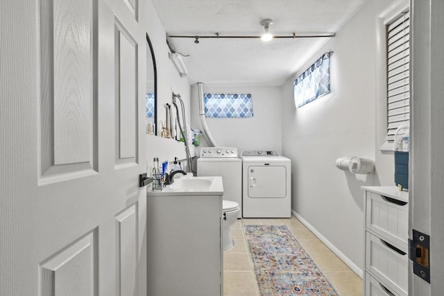 bathroom with separate washer and dryer, vanity, tile patterned flooring, and toilet