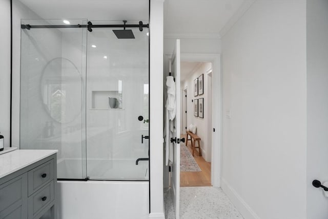 7 Newman St, Cambridge, MA 02140 - bathroom featuring speckle patterned floor, crown molding, enclosed tub / shower combo, baseboards, and vanity