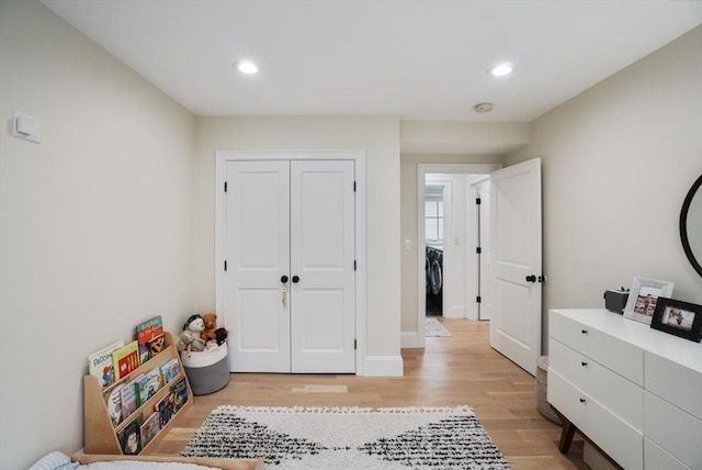 7 Newman St, Cambridge, MA 02140 - bedroom featuring washer / clothes dryer, light wood-style flooring, recessed lighting, and a closet