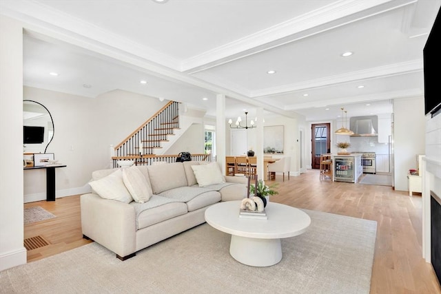 7 Newman St, Cambridge, MA 02140 - living room featuring light wood-style flooring, a chandelier, plenty of natural light, stairway, and recessed lighting