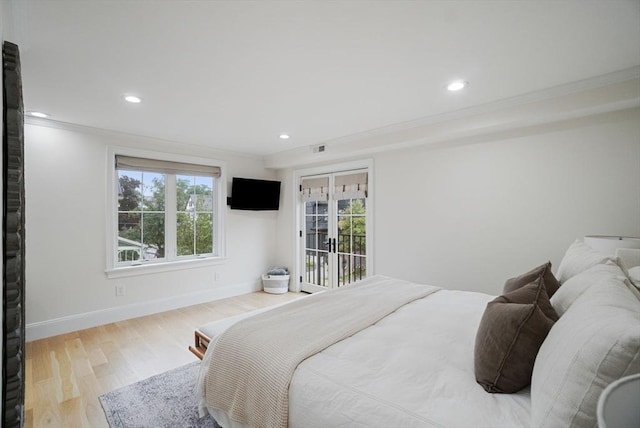 7 Newman St, Cambridge, MA 02140 - bedroom with wood finished floors, ornamental molding, recessed lighting, baseboards, and access to outside