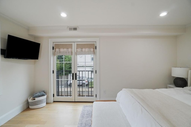 7 Newman St, Cambridge, MA 02140 - bedroom with french doors, access to outside, ornamental molding, wood finished floors, and baseboards