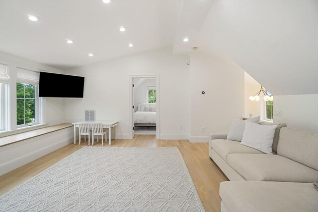 7 Newman St, Cambridge, MA 02140 - living area featuring light wood-style flooring, plenty of natural light, recessed lighting, vaulted ceiling, and baseboards