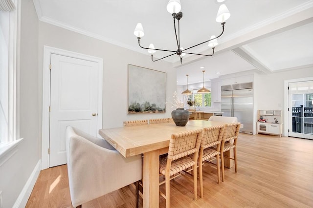 7 Newman St, Cambridge, MA 02140 - dining room featuring a chandelier, healthy amount of natural light, light wood-type flooring, baseboards, and ornamental molding