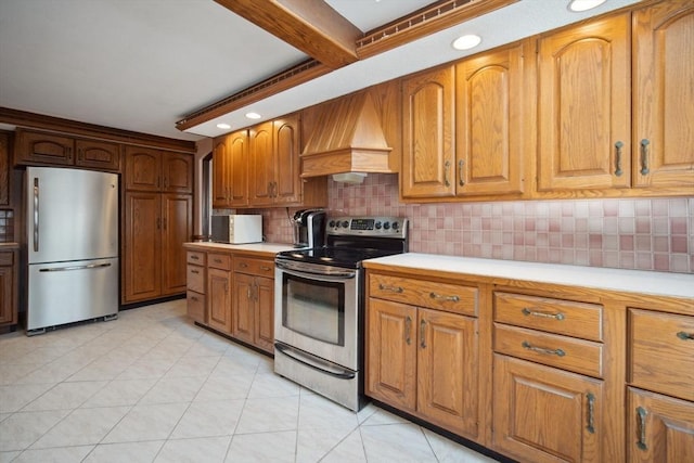 kitchen featuring beamed ceiling, backsplash, light tile patterned floors, stainless steel appliances, and custom range hood