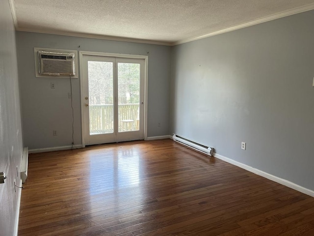 unfurnished room featuring baseboard heating, a wall unit AC, ornamental molding, and wood-type flooring