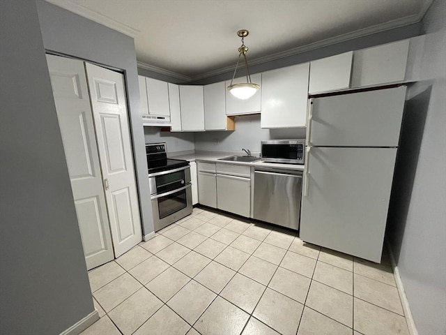 kitchen with a sink, ornamental molding, light tile patterned flooring, appliances with stainless steel finishes, and under cabinet range hood