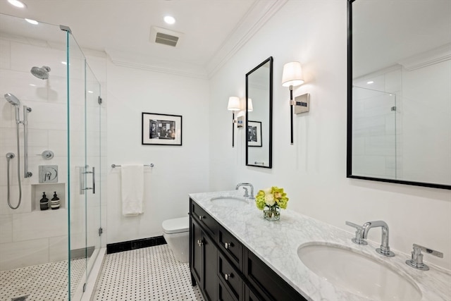 bathroom with an enclosed shower, vanity, toilet, and crown molding