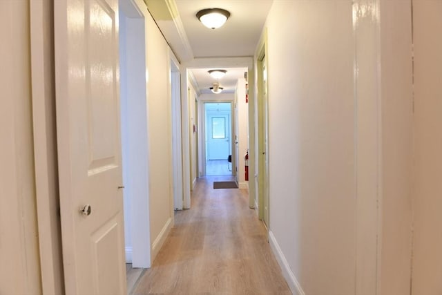 hall with light hardwood / wood-style floors