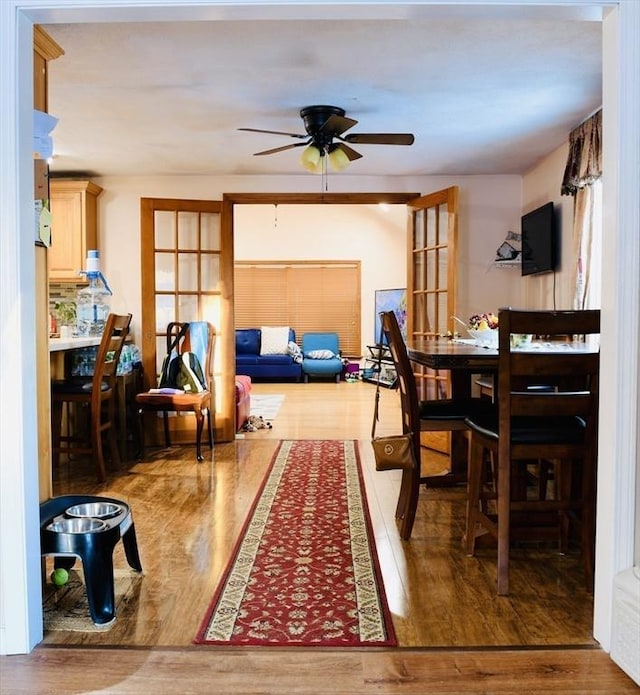 dining room featuring hardwood / wood-style floors and ceiling fan