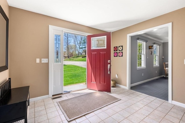 57 Bouffard Dr, Marlborough, MA 01752 - foyer with baseboards, crown molding, and light tile patterned floors