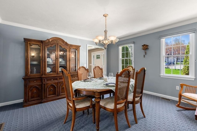 57 Bouffard Dr, Marlborough, MA 01752 - dining area featuring baseboards, a notable chandelier, ornamental molding, and carpet