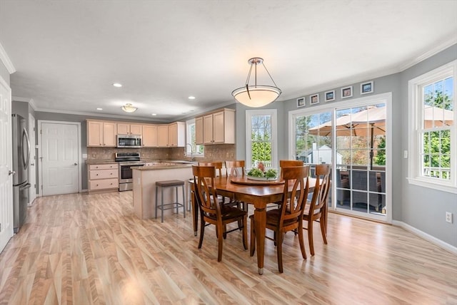 57 Bouffard Dr, Marlborough, MA 01752 - dining area with light wood-type flooring, ornamental molding, baseboards, and recessed lighting