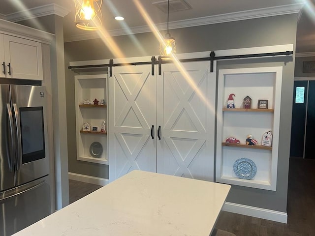48 Round Farm Rd, Rehoboth, MA 02769 - detailed view of smart refrigerator, a barn door, crown molding, built in features, and baseboards