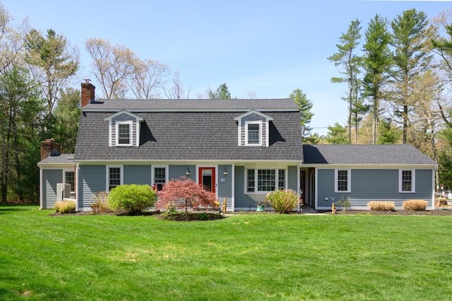 dutch colonial with a front lawn and a chimney