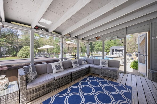 sunroom with outdoor lounge area and beamed ceiling
