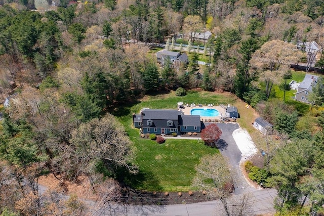 drone / aerial view featuring a view of trees