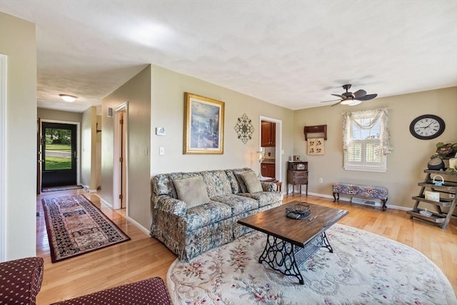 45 Washington St Unit B7, Methuen, MA 01844 - living room with wood finished floors, a ceiling fan, and baseboards