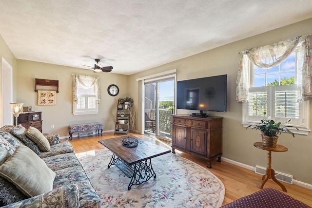 45 Washington St Unit B7, Methuen, MA 01844 - living area with plenty of natural light, ceiling fan, light wood finished floors, and baseboards