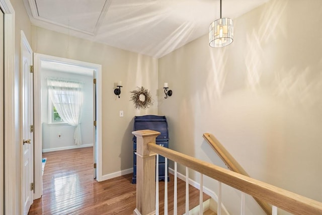 45 Washington St Unit B7, Methuen, MA 01844 - hall featuring attic access, wood finished floors, an upstairs landing, and baseboards