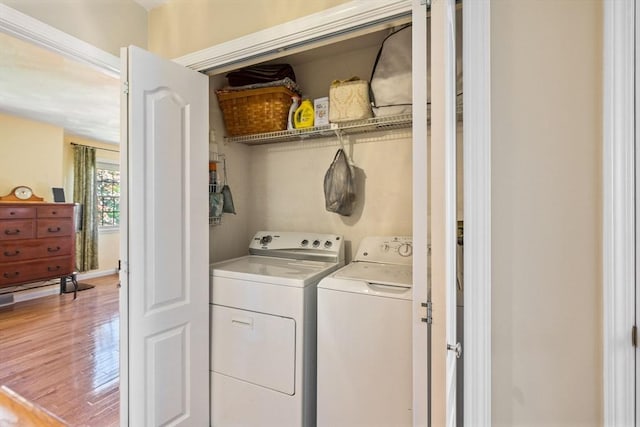45 Washington St Unit B7, Methuen, MA 01844 - washroom featuring separate washer and dryer and light wood-type flooring