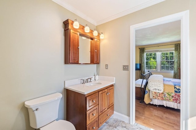 45 Washington St Unit B7, Methuen, MA 01844 - ensuite bathroom featuring vanity, crown molding, toilet, and baseboards