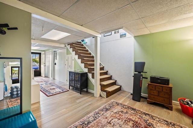 45 Washington St Unit B7, Methuen, MA 01844 - basement with wood finished floors, stairs, a paneled ceiling, and baseboards