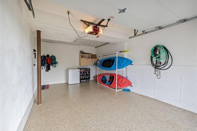 45 Washington St Unit B7, Methuen, MA 01844 - garage with a garage door opener and refrigerator