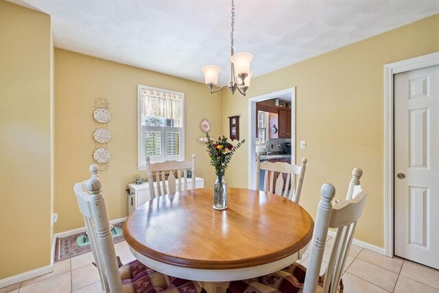 45 Washington St Unit B7, Methuen, MA 01844 - dining room with a chandelier, light tile patterned floors, and baseboards