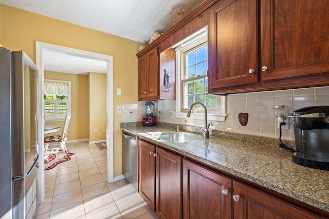 45 Washington St Unit B7, Methuen, MA 01844 - kitchen featuring stainless steel appliances, a sink, tasteful backsplash, and healthy amount of natural light