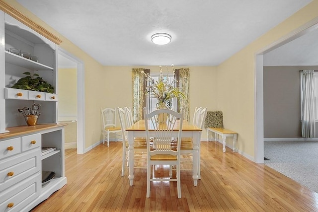 dining room with light wood-type flooring