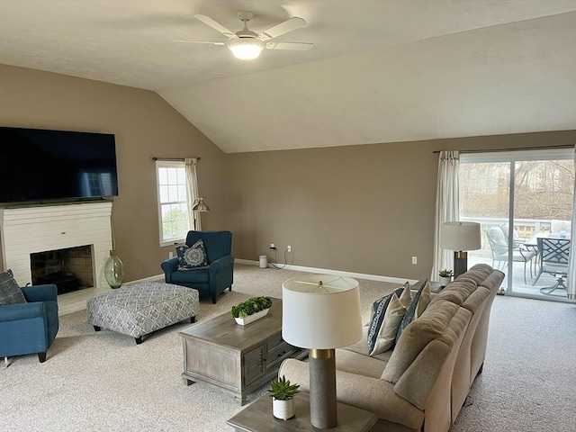 living room with ceiling fan, light carpet, and vaulted ceiling