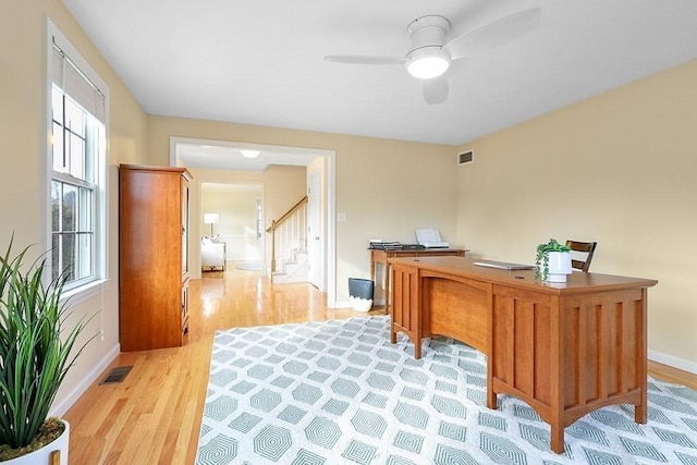 office area featuring ceiling fan and light hardwood / wood-style floors