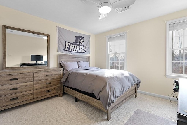 carpeted bedroom with ceiling fan