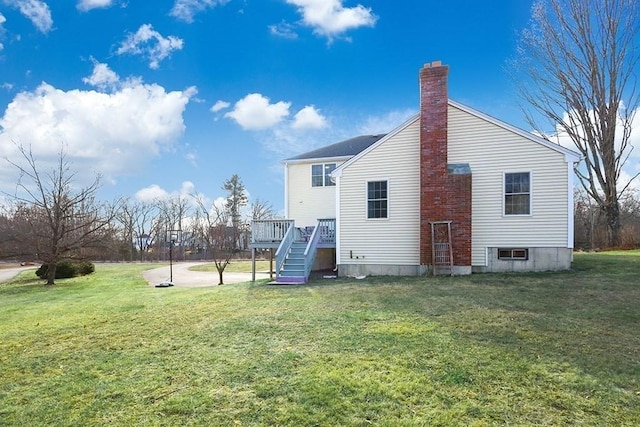 rear view of house with a yard