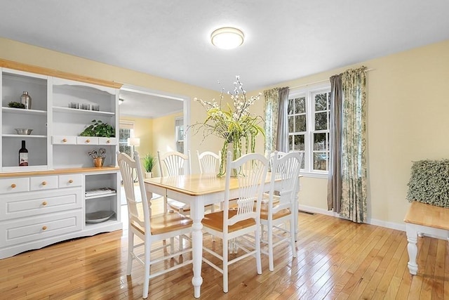 dining room with light hardwood / wood-style floors