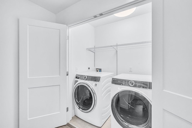 washroom with washer and clothes dryer