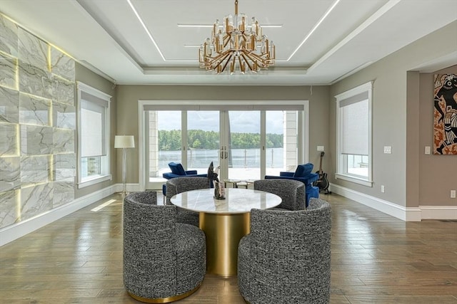290 Massapoag Rd, Tyngsborough, MA 01879 - dining area with french doors, plenty of natural light, a chandelier, and a raised ceiling