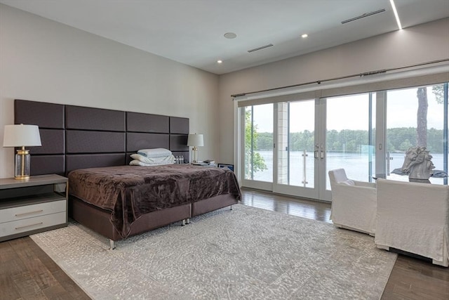 290 Massapoag Rd, Tyngsborough, MA 01879 - bedroom with access to exterior, wood finished floors, french doors, recessed lighting, and a water view