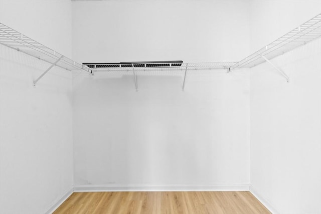 walk in closet featuring light wood-style floors and visible vents