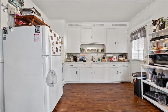 kitchen featuring dark hardwood / wood-style floors, tasteful backsplash, white cabinets, white fridge, and crown molding