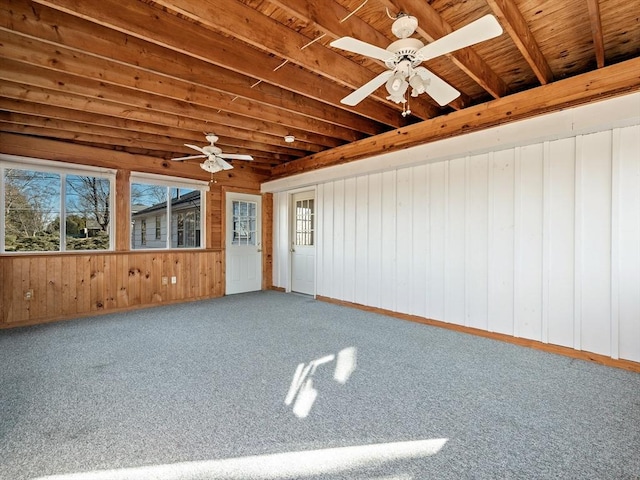 unfurnished sunroom featuring ceiling fan and wood ceiling