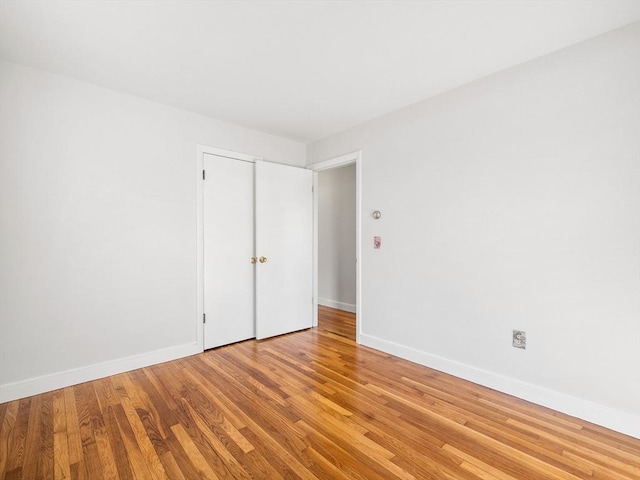 spare room featuring light hardwood / wood-style flooring