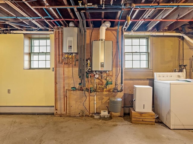 basement with washing machine and clothes dryer, water heater, and a baseboard radiator