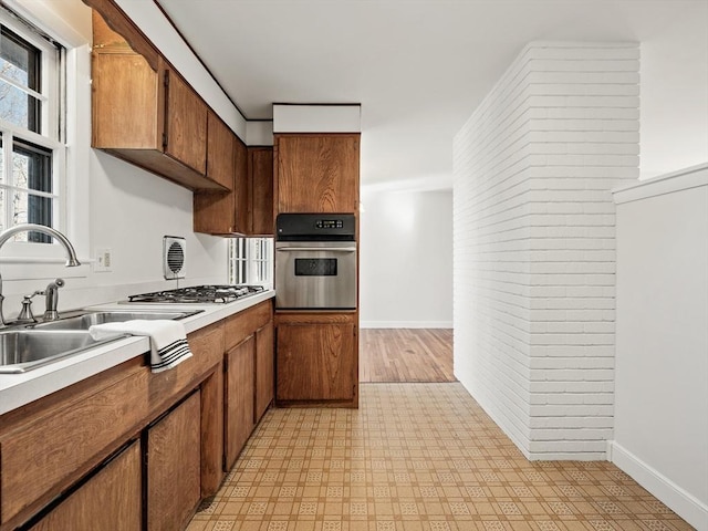 kitchen with sink and appliances with stainless steel finishes