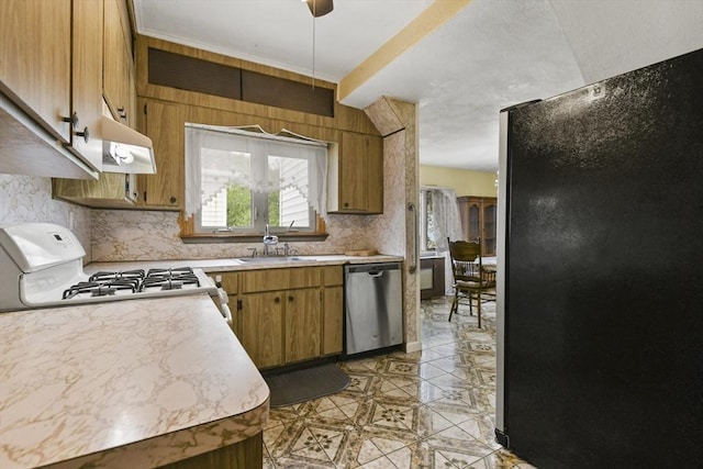 23 Highland Rd, Somerville, MA 02144 - kitchen with freestanding refrigerator, dishwasher, under cabinet range hood, and light countertops