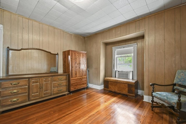 23 Highland Rd, Somerville, MA 02144 - sitting room featuring hardwood / wood-style floors, wood walls, and cooling unit
