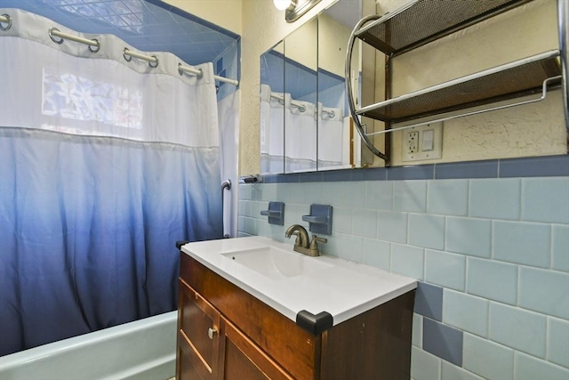 23 Highland Rd, Somerville, MA 02144 - full bathroom with vanity, shower / bath combo with shower curtain, and tile walls