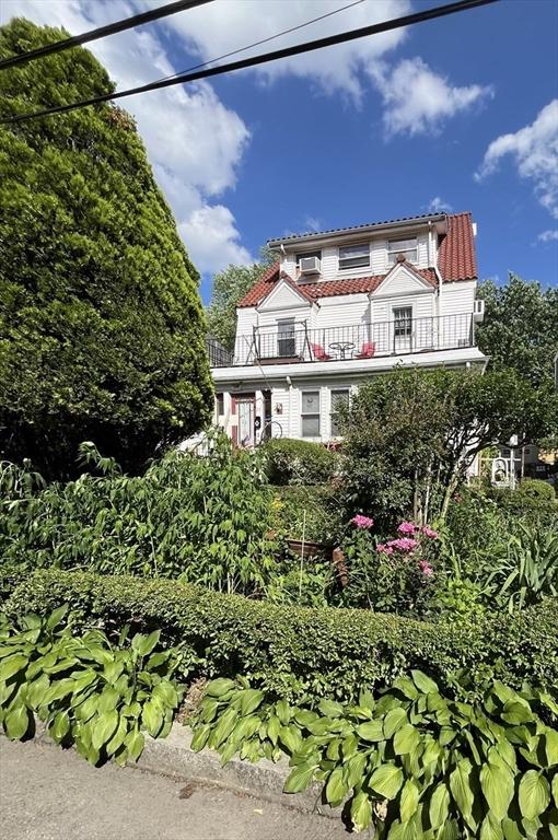 23 Highland Rd, Somerville, MA 02144 - view of front facade with a balcony and a tile roof