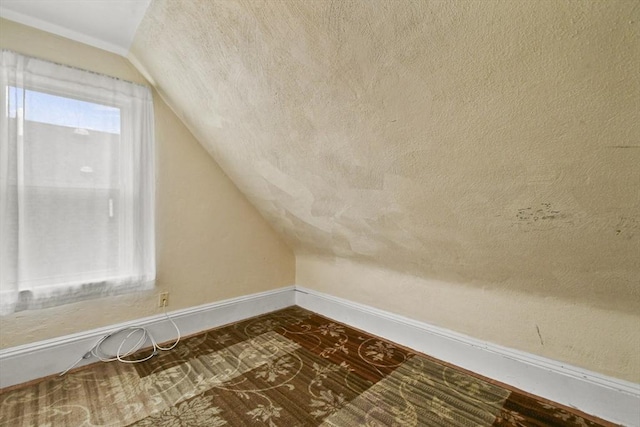 23 Highland Rd, Somerville, MA 02144 - additional living space with vaulted ceiling and a textured ceiling